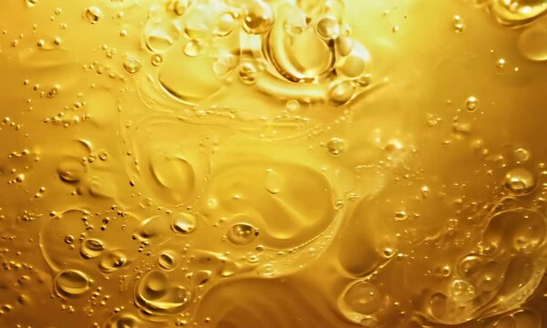 Abstract background of yellow liquid with bubbles forming on its surface, creating a mesmerizing and visually appealing pattern