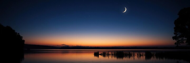 Naklejka premium The silhouette of a lake against the darkening sky with stars and a crescent moon, night, norway, nature