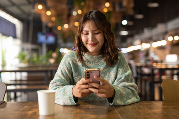 Portrait of Beautiful And Young Cute Asian Woman Having Coffee Break in Cafe Restaurant