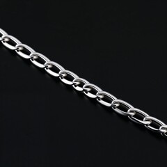Sterling silver Cuban link chain bold and masculine on plain black dark background