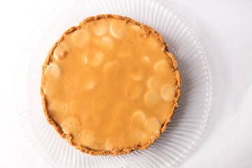 Banoffee banana pie with caramel sauce on the white background. Traditional english cake. Ready to eat. Cooking concept