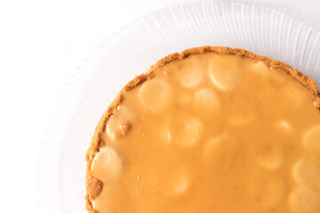 Banoffee banana pie with caramel sauce on the white background. Traditional english cake. Ready to eat. Cooking concept