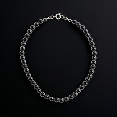 Oxidized silver chain with onyx beads bold and mysterious on plain black dark background