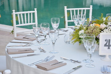 Rustic White and Green Wedding Table Setting with Citrus Centerpiece and Lake View