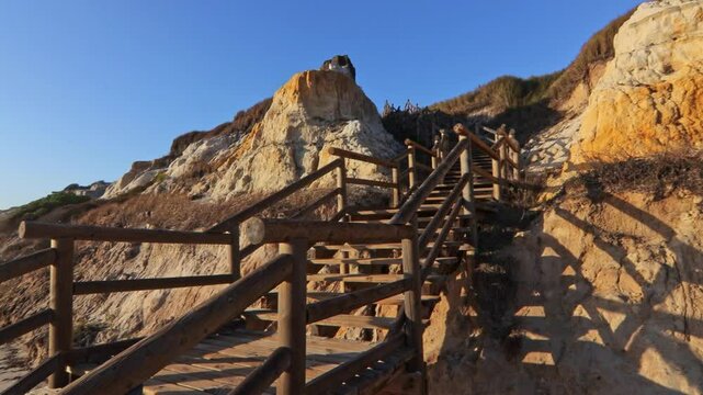 Walkway with wooden steps on Cuesta Maneli beach, located in a very unique environment, the fossil dune system of El Asperillo, located within the Do&ntilde;ana Natural Park , Huelva, Spain.