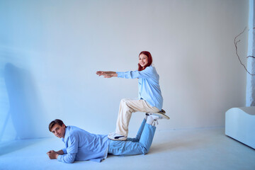 teenage sister and adult brother play together for a photo