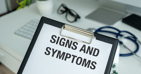 Female doctor holding a tablet with the text: Signs and Symptoms