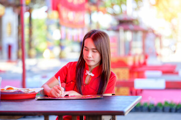 Young Girl Writing in a Bright Outdoor Setting