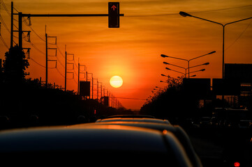 Sunset Above Traffic with Silhouetted Power Lines