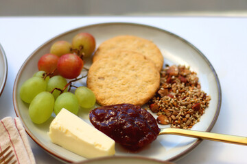 Assortment of various breakfast foods and drinks on the white table. Selective focus.