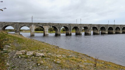 Old stone bridge over Shannon river At Shannonbridge,  county Offaly, Ireland, historic landmark,...