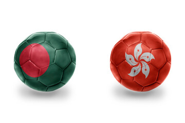 football balls with national flags of hong kong and bangladesh, soccer teams. on the white background.