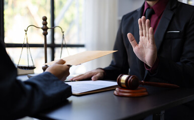 Honest officer or lawyer refuses to take bribes from criminals. Businessman refusing to accept...