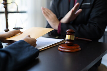 Honest officer or lawyer refuses to take bribes from criminals. Businessman refusing to accept...