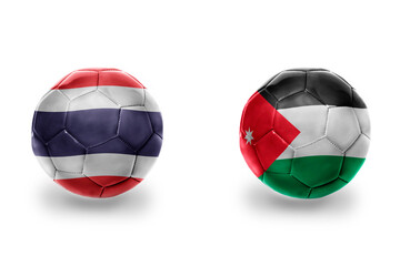 Fototapeta premium football balls with national flags of jordan and thailand , soccer teams. on the white background.