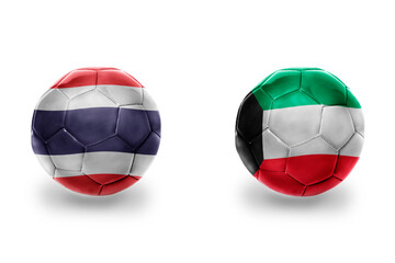 Obraz premium football balls with national flags of kuwait and thailand , soccer teams. on the white background.