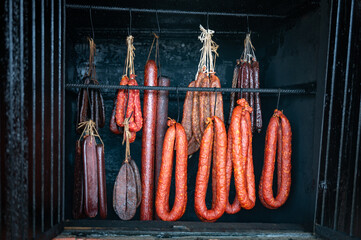 hanging rack of various types of sausages