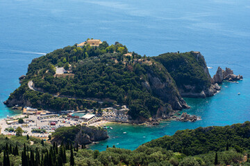 Panoramic view of Paleokastritsa Monastery, Corfu island, Greece. Amazing blue sea
