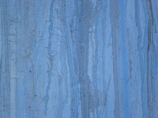 Abstract Grunge blue wall background, texture of blue decorative plaster or concrete.