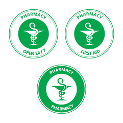 Green pharmacy labels with the draw of a snake and a cup on a white background