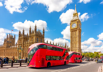 Double-decker buses on Westminster bridge with Big Ben and Houses of Parliament, London, UK