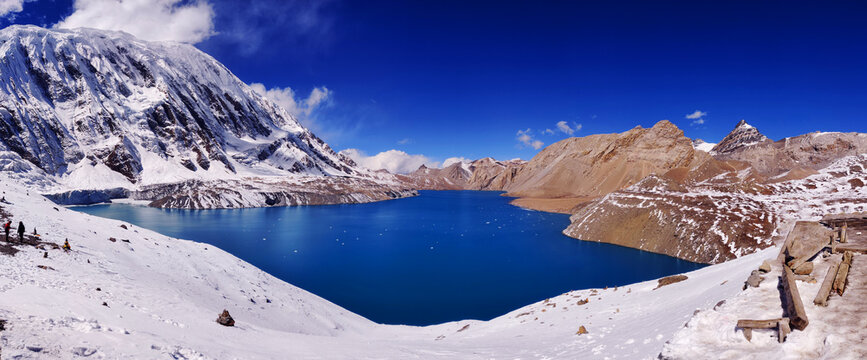 Tilicho Lake panorama, one of the world&rsquo;s highest lakes. Crystal-clear blue waters of Tilicho Lake nestled in the majestic Himalayas. Glacial lake. Panoramic view of Tilicho Lake.