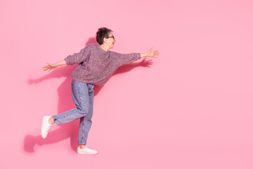 Full length photo of cheerful pretty lady dressed pullover dancing empty space isolated pink color background
