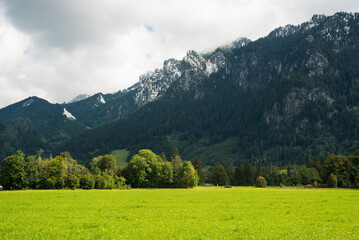 Obraz premium clouds over the snow peaked mountains