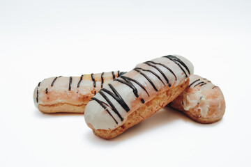 Eclairs glazed. Chocolate eclairs isolated on white background