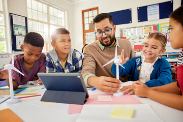 Elementary students learning about renewable energy with wind turbine