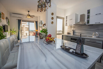 Interior design of luxury apartment living room with kitchen