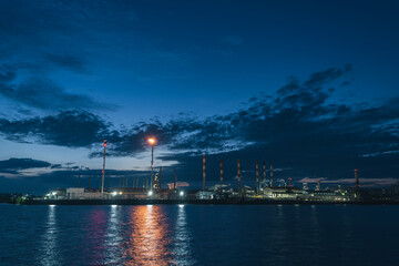 Photo of the Balikpapan city refinery seen from a distance during the morning blue hour before sunrise, Balikpapan, November 4 2024, East Kalimantan, Indonesia