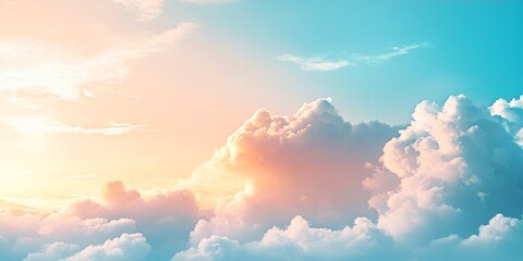 Soft pastel cloudscape with warm golden light in a serene blue sky, evoking peace and tranquility for backgrounds and creative visuals