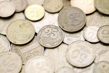 Big pile of different coins from various time period in Ukraine. Shiny Ukrainian money background