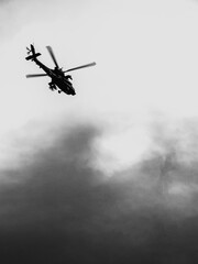 Silhouette of a Helicopter in Dramatic Sky