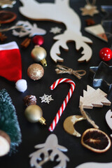 Various Christmas decorations in neutral colors on dark background. Selective focus.