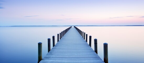Fototapeta premium Serene Pier Stretching out into Calm Waters