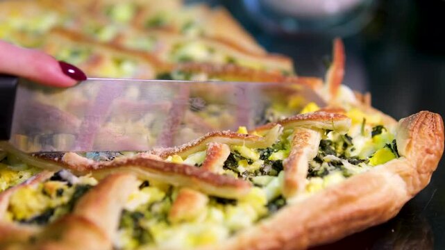 spinach pie Classic Quiche with spinach. Fish tart. Open faced salmon quiche on kitchen table with broccoli pieces and savory pie on background.