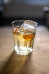 Refreshing Whiskey Cocktail with Orange Peel in Seville