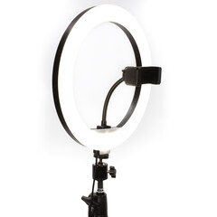 Photo of a ring lamp on a white background. Lighting for shooting videos, photos, blogs, video calls. Product photo for online store and website.