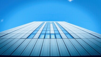 Modern Skyscraper against Clear Blue Sky: Perfect for Architectural Design, Building Inspiration, and Urban Landscape Photography