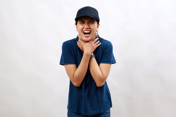 Young hispanic woman courier wearing delivery uniform and cap shouting and suffocate because painful strangle. health problem. asphyxiate and suicide concept.