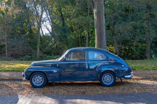 Classic Volvo 544 2 door car vehicle parked on scenic suburban street