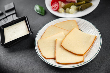 Raclette cheese food dish fresh gourmet tasty food background on the table rustic food top view copy space top view