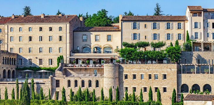 GORDES, PROVENCE, FRANCE - JULY 7, 2012: luxury hotel and restaurant "La Bastide", swimming pool, in one of the most beautiful villages in France, stone house with terracotta roof tiles called a "Mas"