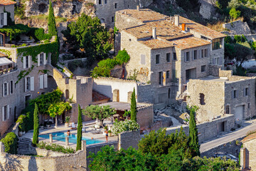 GORDES, PROVENCE, FRANCE - JULY 7, 2012: luxury holiday home with swimming pool, in one of the most beautiful villages in France, traditional stone house with terracotta roof tiles called a "Mas" © Pvince73