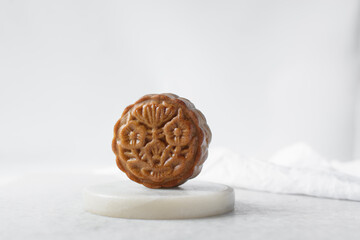 homemade mooncakes on a white background, top view of baked mooncakes on white table, process of making mooncakes for Lunar New Year and mid autumn festival