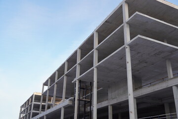 Construction of a concrete building in progress during daylight hours