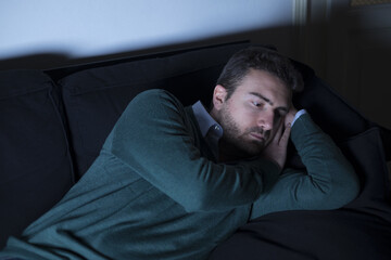 Fototapeta premium Man depressed thinking lying on the couch