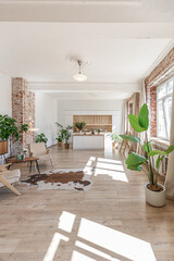 Bright and spacious living area featuring modern furniture and natural light in a stylish apartment in soft warm colors